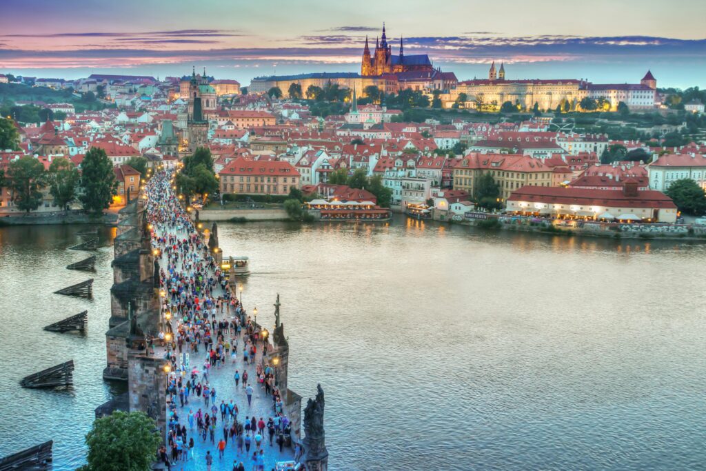 Charles Bridge crossing the Vltava River with Prague Castle in the background