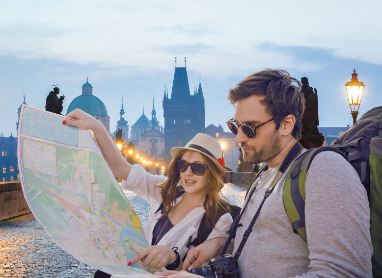 Travelers in Prague using Czech phrases while navigating the city with a map