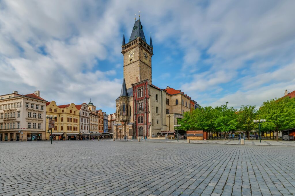 Old Town Square in Prague with historic buildings and crowds near Staromestska metro station