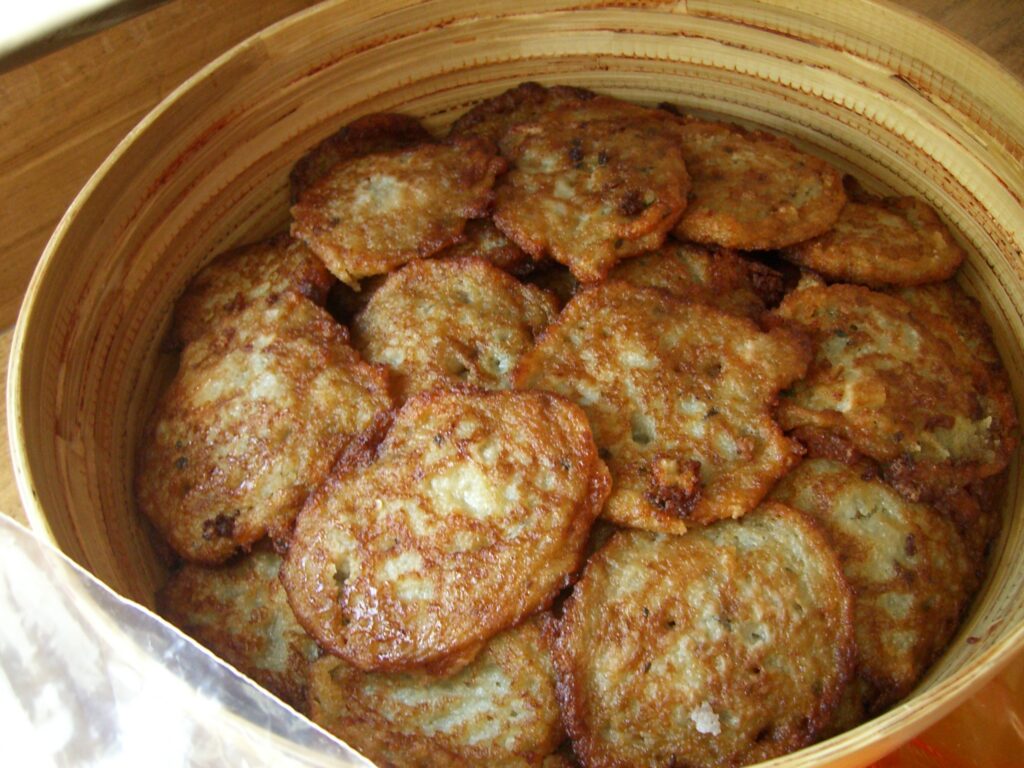 Bramboráky (Czech potato pancakes) crispy fried with garlic and marjoram – traditional street food in Prague Food Guide
