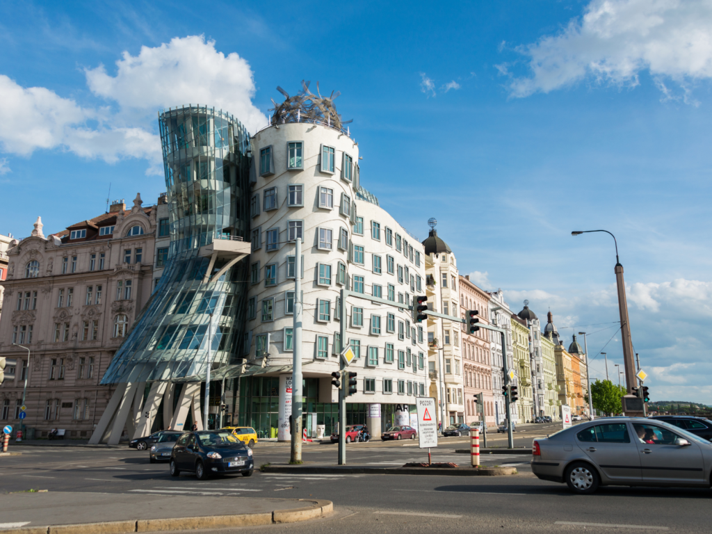 Dancing House surrounded by historic buildings showing contrast between modern and traditional architecture