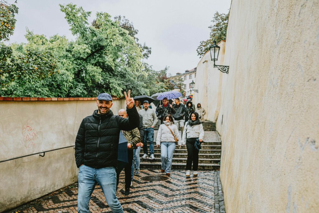 visitors walking respectfully near historical sites in Prague with calm and appropriate behavior