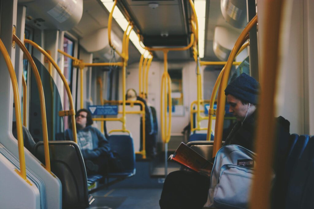 quiet atmosphere inside a Prague tram with passengers sitting calmly and speaking softly