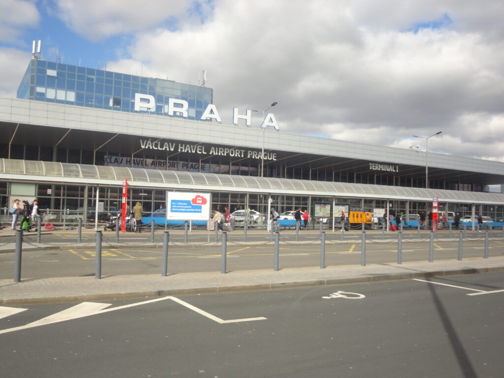 Exterior view of Václav Havel Airport Prague Terminal 1 with passengers and entrance area