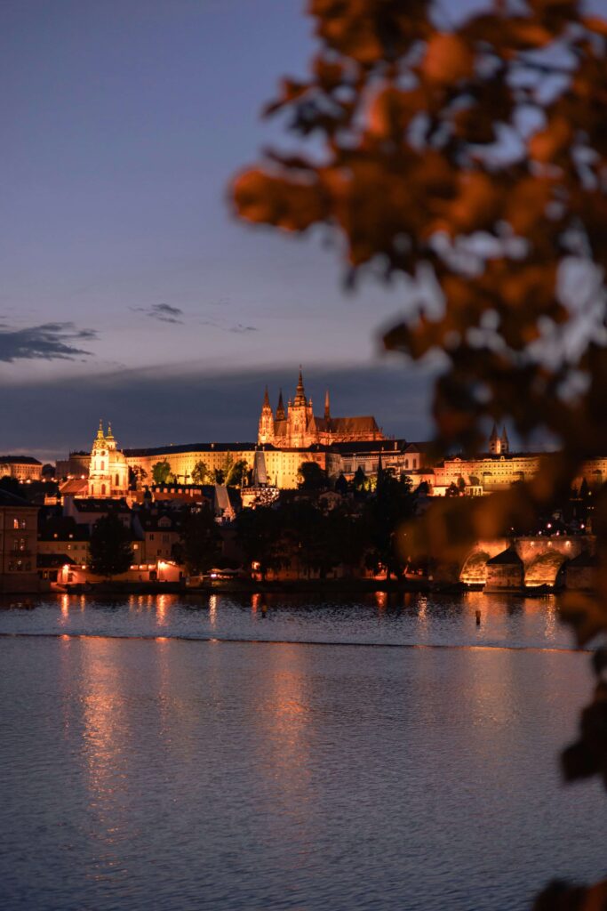 Prague Castles – illuminated night view of Prague Castle across the Vltava River