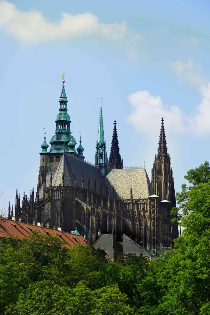 Prague Cathedrals featuring St. Vitus Cathedral at Prague Castle surrounded by historic rooftops and greenery