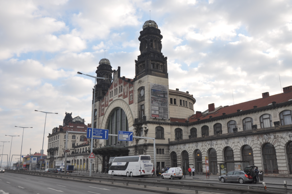 Exterior of Prague Main Station Praha hlavní nádraží with transport connections and train travelers in Prague