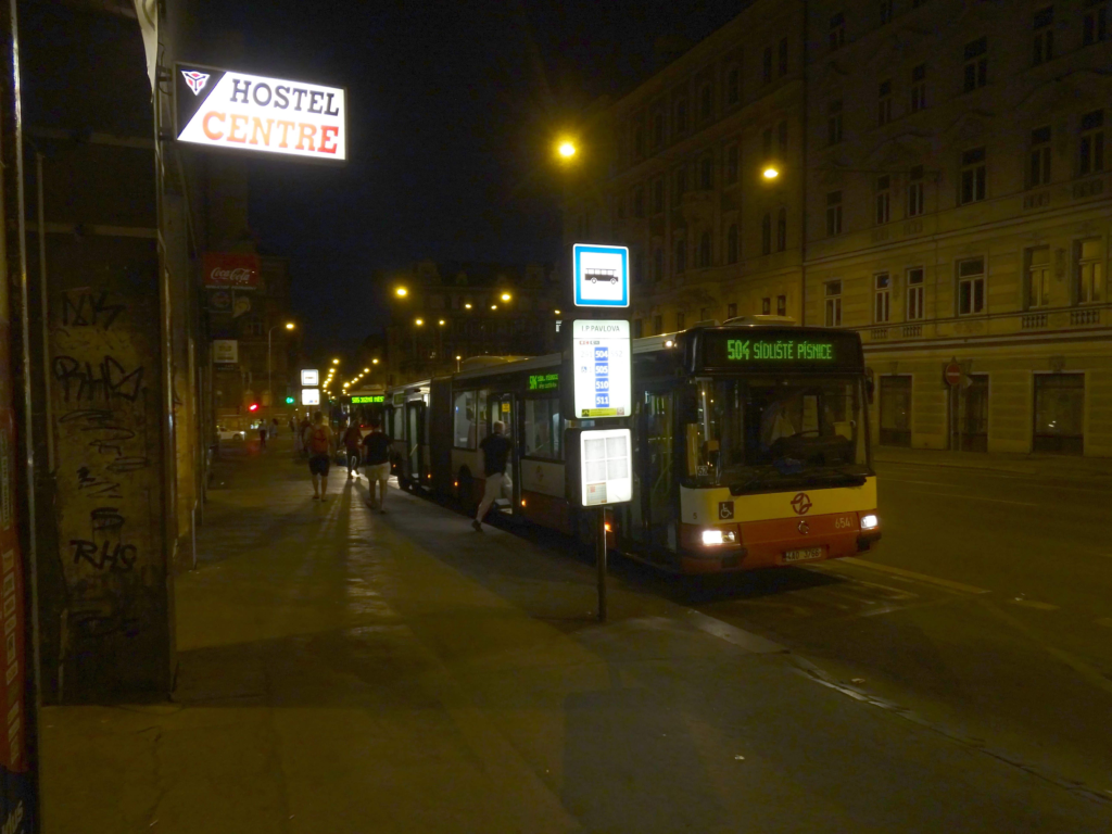 Prague Night Buses 2026 operating after midnight near I. P. Pavlova station with passengers waiting at a night bus stop in Prague.