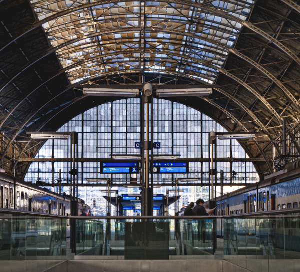 Interior of Prague Train Station Praha hlavní nádraží with train platforms and departure boards in 2026