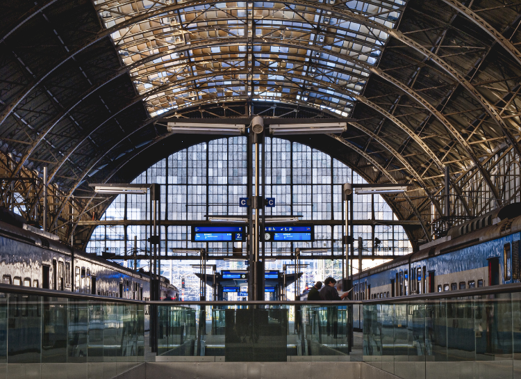 Interior of Prague Train Station Praha hlavní nádraží with train platforms and departure boards in 2026