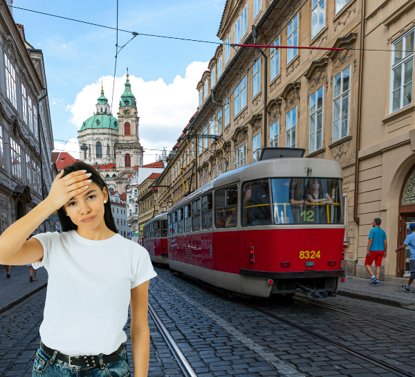 Tourist confused about Prague tram tickets and validation rules with tram in background