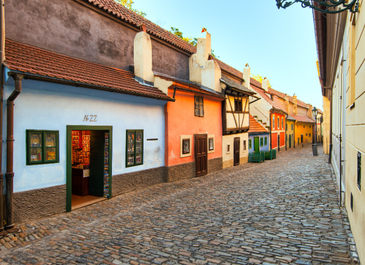 Colorful houses and quiet cobblestone street on Golden Lane at Prague Castle in Prague, Czech Republic, photographed during the early morning before tourist crowds arrive.