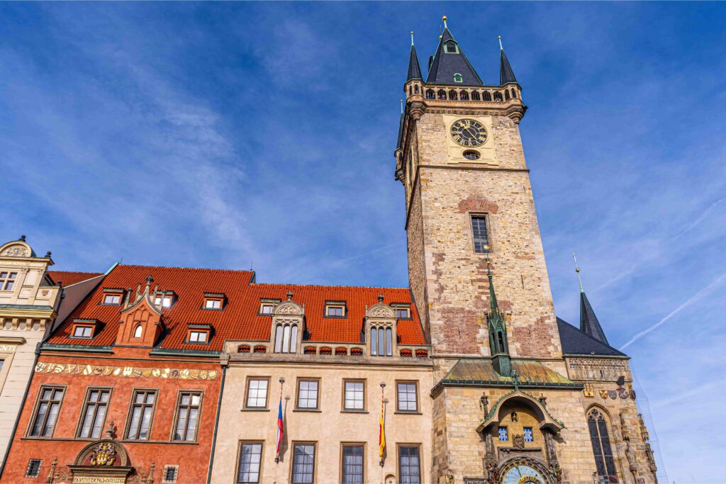 Old Town Hall Tower overlooking Old Town Square Prague with historic architecture and clock tower under a blue sky