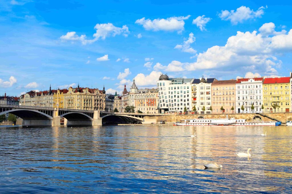 Visitors exploring Prague Bridges can enjoy tranquil river views and historic architecture from Jirásek Bridge.