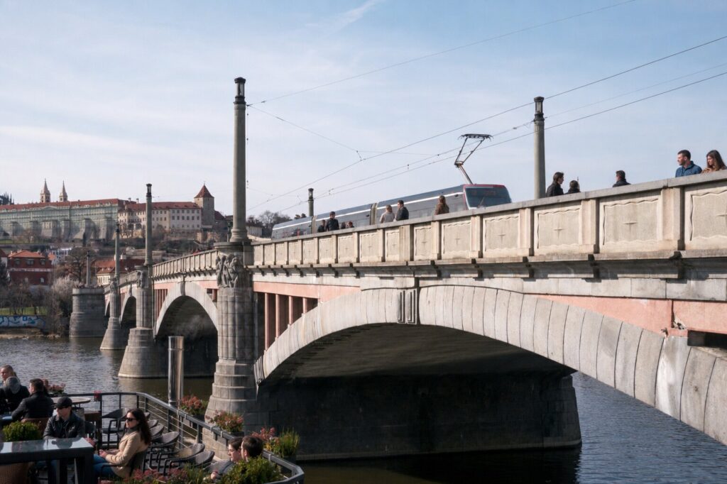 Mánes Bridge is one of the most scenic Prague Bridges, offering stunning views of Prague Castle and the Vltava River.