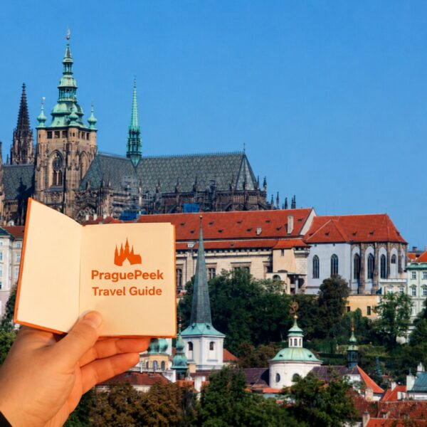 Prague Castle view with PraguePeek Travel Guide booklet in Prague