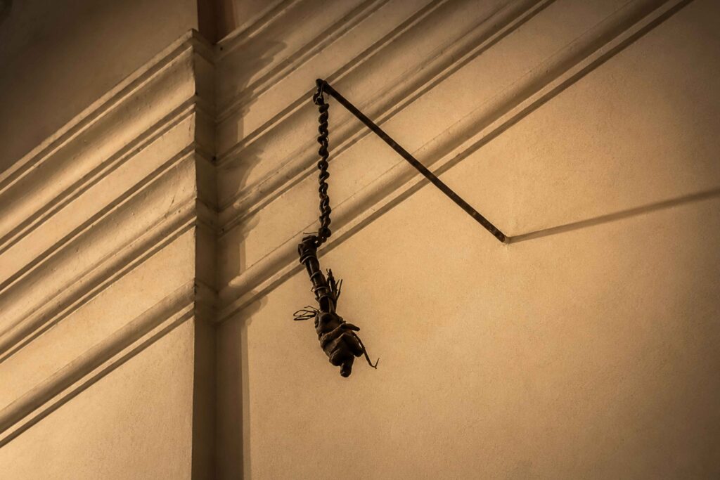 The mummified arm hanging inside St. James Church Prague, linked to the legend of a thief punished for stealing from the Virgin Mary, one of the most chilling dark stories in Prague