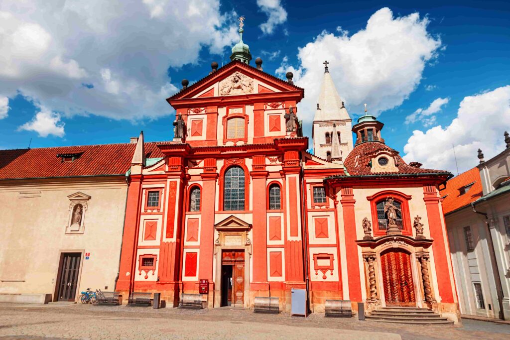Prague Architecture – Basilica of St. George, the oldest surviving Romanesque church in Prague Castle with its iconic red façade and twin white towers