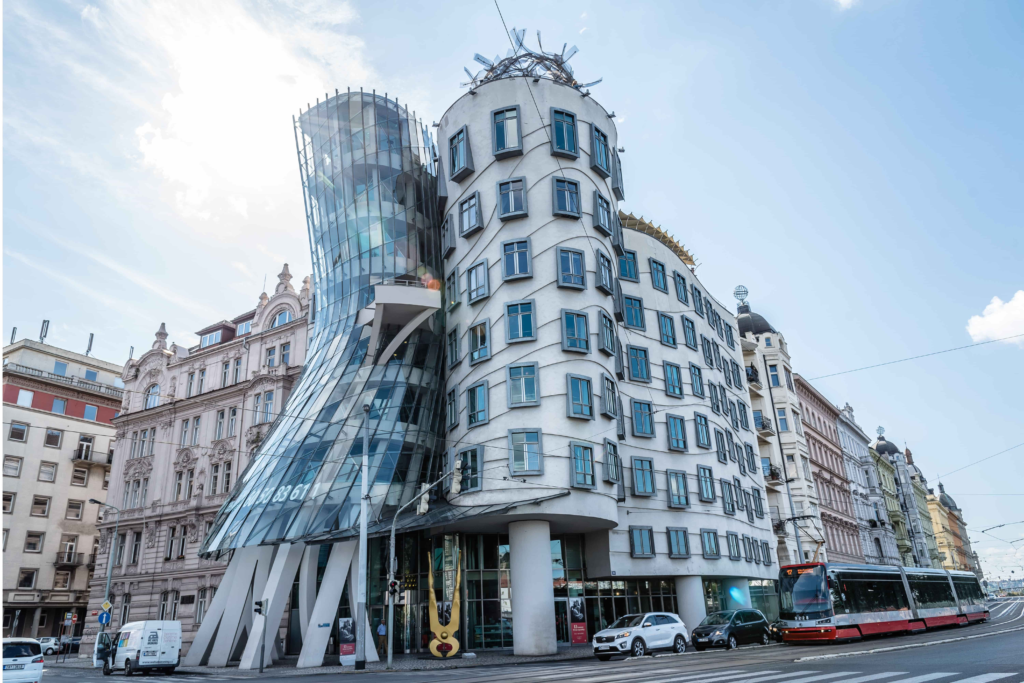 Prague Architecture – Dancing House, Prague's iconic Deconstructivist landmark designed by Frank Gehry and Vlado Milunić, featuring its distinctive curved glass and concrete towers