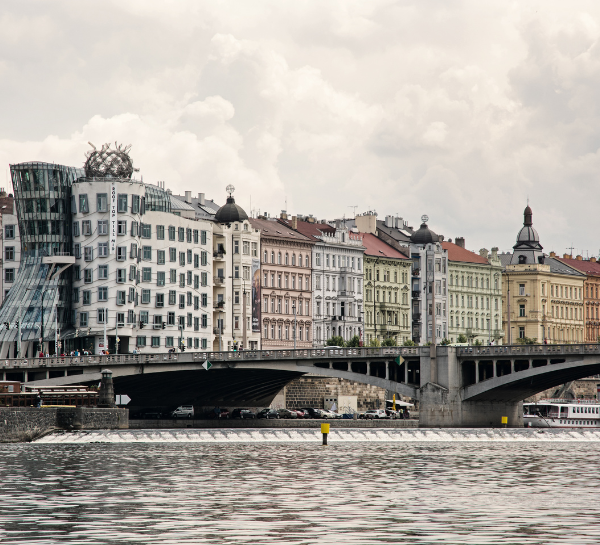 Prague Architecture: panoramic view of famous buildings including the Dancing House along the Vltava River