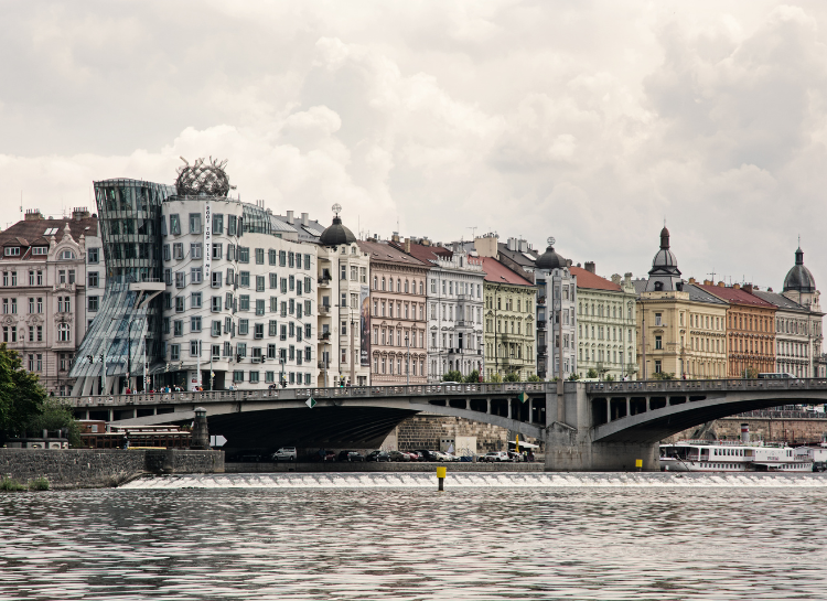 Prague Architecture: panoramic view of famous buildings including the Dancing House along the Vltava River