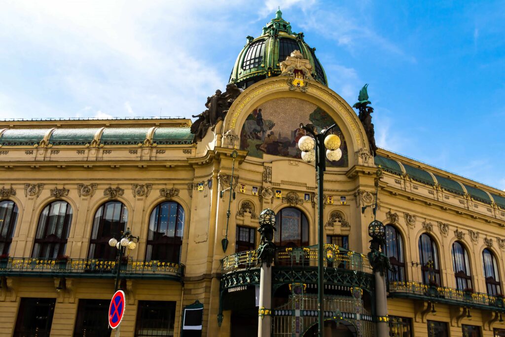 Prague Architecture – Municipal House (Obecní dům), an Art Nouveau masterpiece in Prague with an ornate façade, colorful mosaic, elegant dome, and decorative ironwork