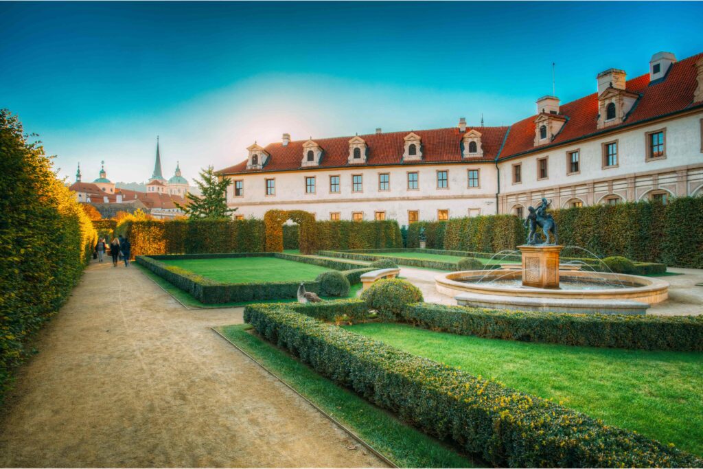 Prague Architecture – Wallenstein Palace, an early Baroque landmark in Prague featuring elegant palace gardens, manicured hedges, fountains, and historic architecture