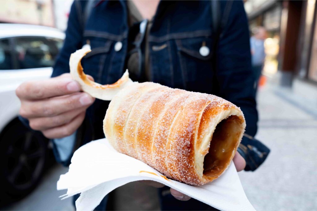Fresh trdelník, a popular and affordable street food in Prague on a budget
