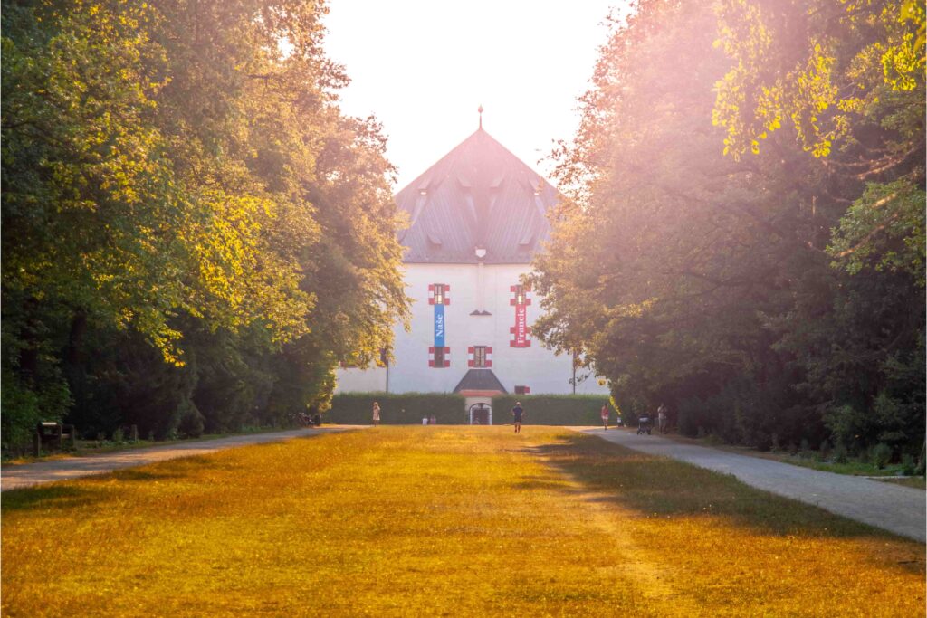Hvězda Summer Palace surrounded by tree-lined paths in Obora Hvězda, one of the most peaceful Prague Parks for walking and nature