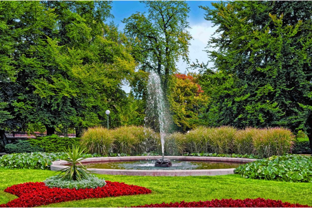 Landscaped lawns, ornamental flower beds, and a fountain in the Royal Garden at Prague Castle, one of Prague's most historic parks