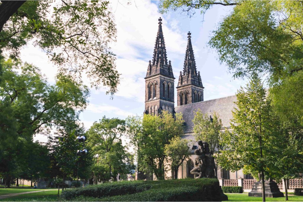 Basilica of St. Peter and St. Paul surrounded by the peaceful Vyšehrad Gardens, one of the most historic Prague Parks.