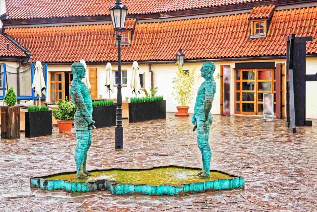 Unusual Museums in Prague - Franz Kafka Museum courtyard with the famous Piss sculpture near Charles Bridge