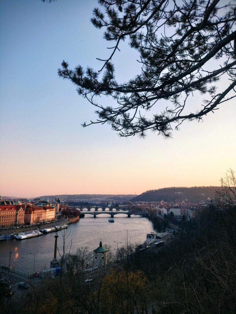 Prague Rivers and Vltava River viewed from a hillside at sunset