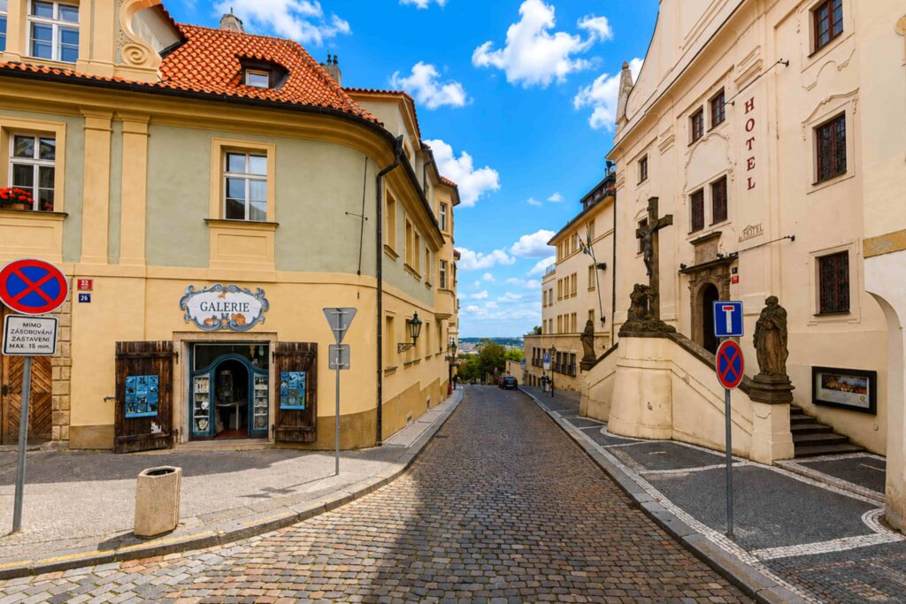 Prague Streets – Úvoz Street with historic architecture, cobblestone road, and scenic views in Prague's Castle District