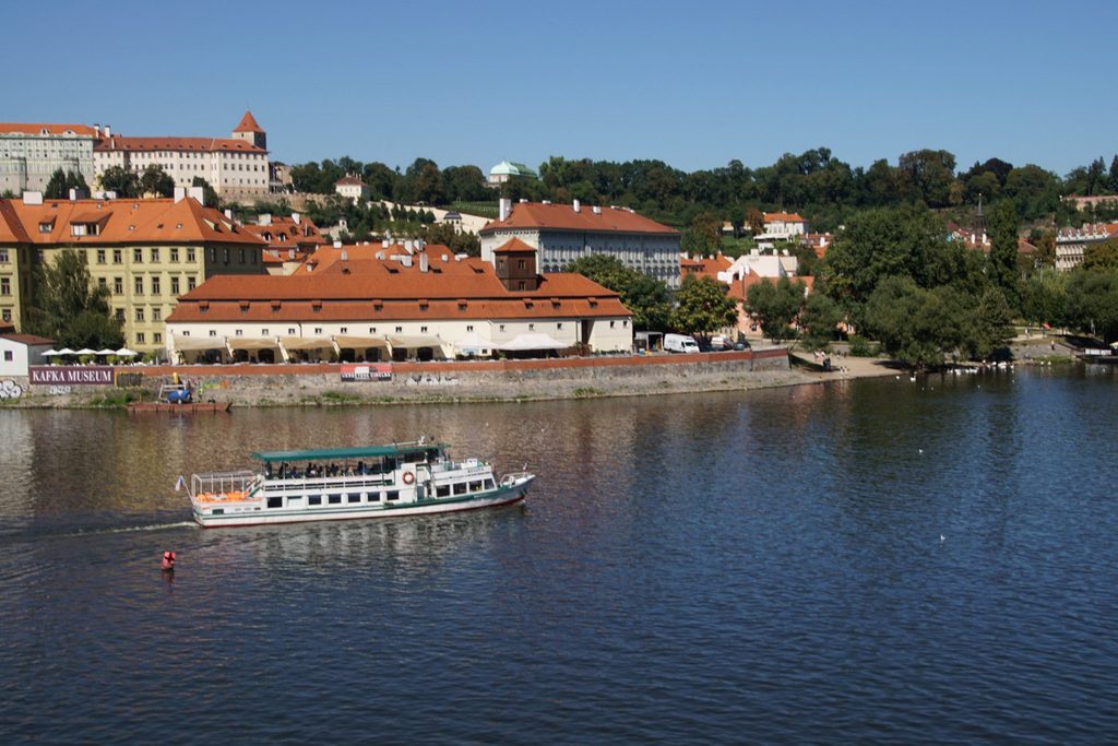 Prague water activities on the Vltava River with a sightseeing cruise and historic riverside buildings