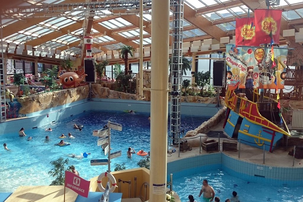 Indoor water park in Prague with swimming pools and a pirate ship play area