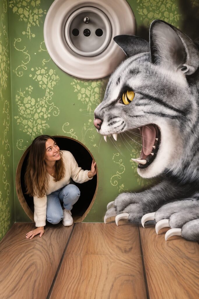 Prague Fun Experiences featuring a woman enjoying an interactive 3D art illusion