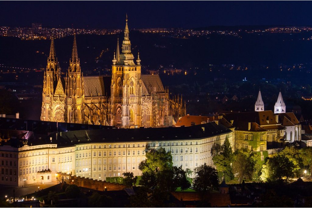 Prague Night Activities featuring Prague Castle illuminated at night above the historic city skyline