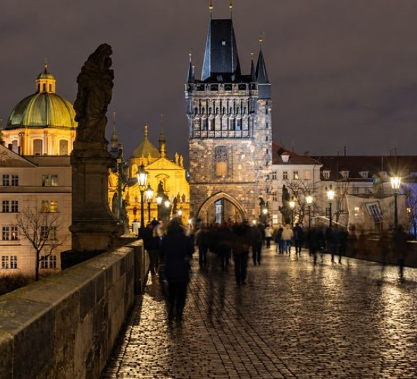 Prague Night Activities on Charles Bridge with Prague's illuminated Old Town at night