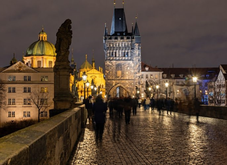 Prague Night Activities on Charles Bridge with Prague's illuminated Old Town at night