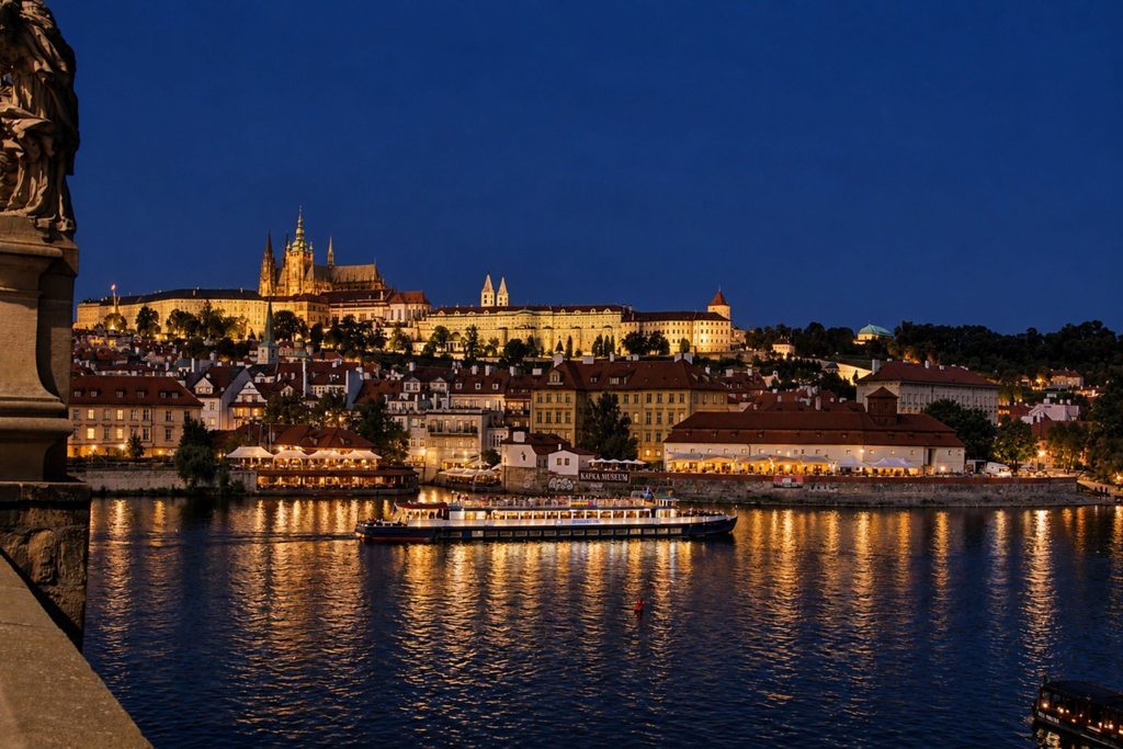 Prague Night Activities featuring an evening Vltava River cruise with Prague Castle illuminated in the background