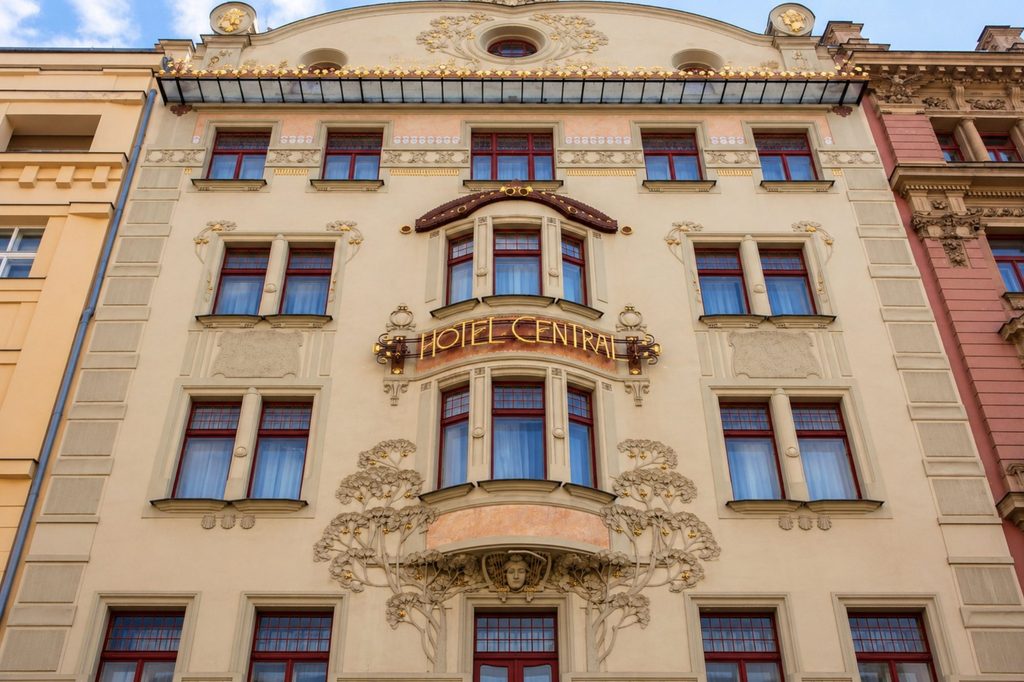 Hotel Central on Hybernská Street showcasing Art Nouveau Prague architecture and ornate natural motifs