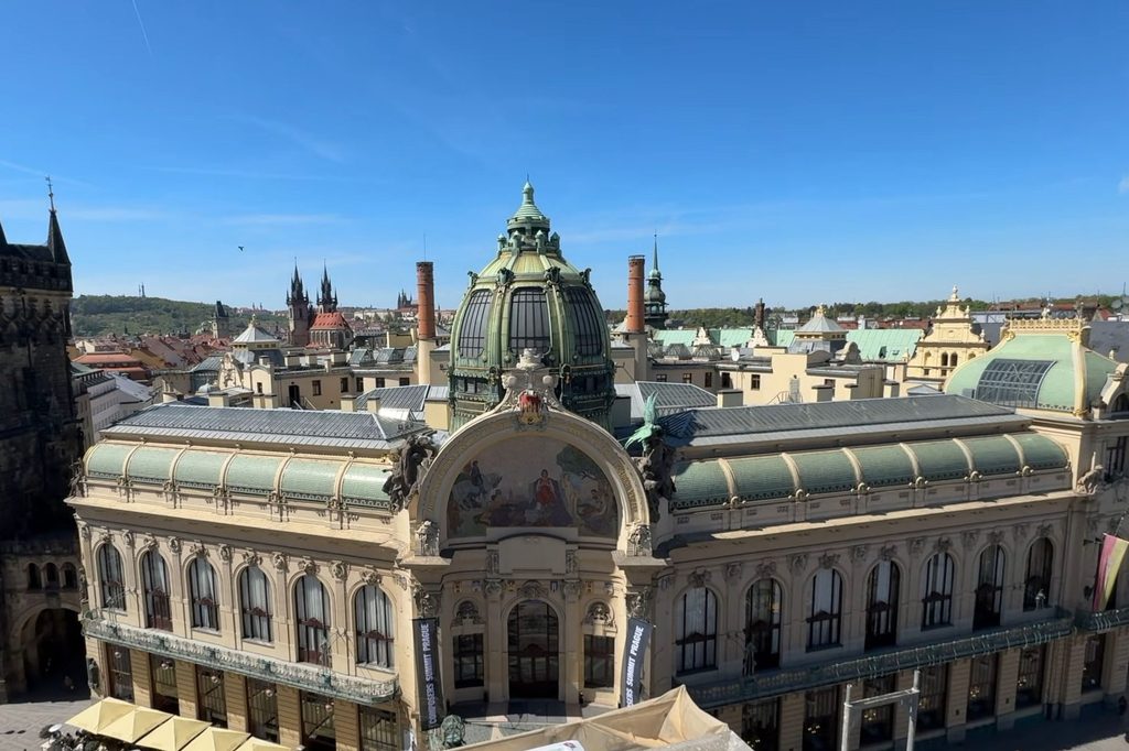 Municipal House showcasing Art Nouveau Prague architecture with its ornate dome, mosaic and decorative facade